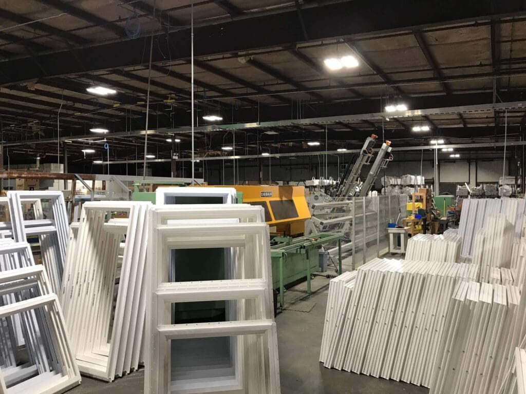 A warehouse filled with lots of white furniture.